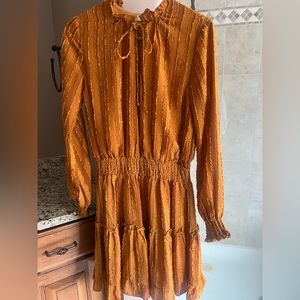 Nordstrom brand “Emma” dress. Textured Ruffle with tie at the neck.